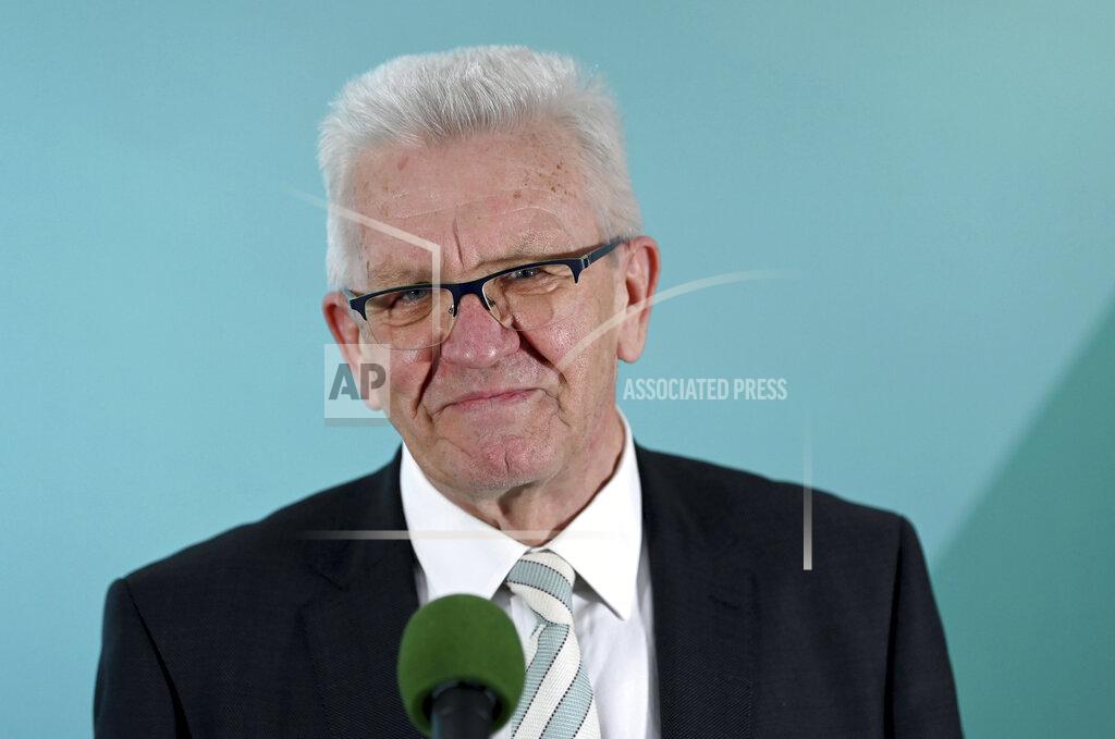 Marijan Murat Winfried Kretschmann, Minister President of Baden-Wuerttemberg and top candidate of the Green Party, comments on the results of the state elections in Baden-Wuerttemberg in the House of Representatives in Stuttgart, Germany, Sunday, March 14, 2021. Exit polls are pointing to defeats for Chancellor Angela Merkel’s center-right party CDU in two German state elections.(Marijan Murat/dpa via AP)
