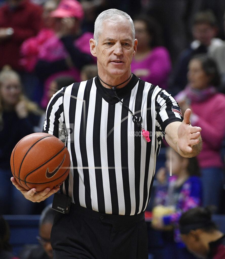 Jessica Hill Referee Bruce Morris officiates an NCAA college basketball game between Connecticut and Temple, Saturday, Feb. 9, 2019, in Storrs, Conn. Morris holds an NCAA record for the longest shot recorded.(AP Photo/Jessica Hill)