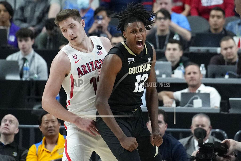 John Locher Colorado's Jabari Walker (12) celebrates after scoring Arizona's Azuolas Tubelis (10) during the first half of an NCAA college basketball game in the semifinal round of the Pac-12 tournament Friday, March 11, 2022, in Las Vegas. (AP Photo/John Locher)
