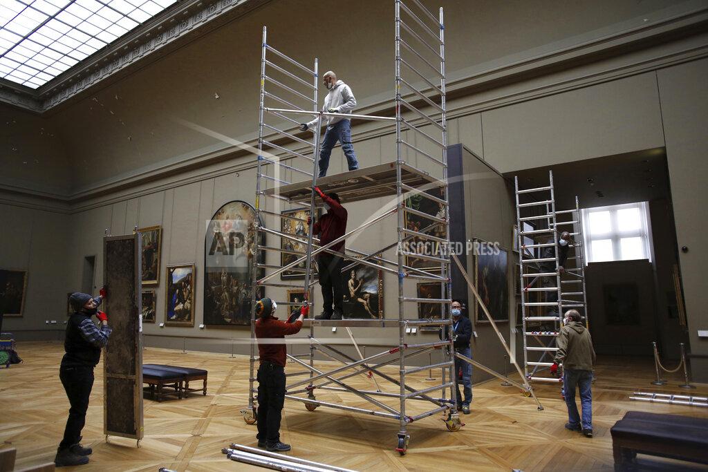 Thibault Camus Workers at the Louvre museum set up a scaffolding in Paris, Tuesday, Feb. 9, 2021. The forced closure has granted museum officials a golden opportunity to carry out long-overdue refurbishments that were simply not possible with nearly 10 million visitors a year. (AP Photo/Thibault Camus)
