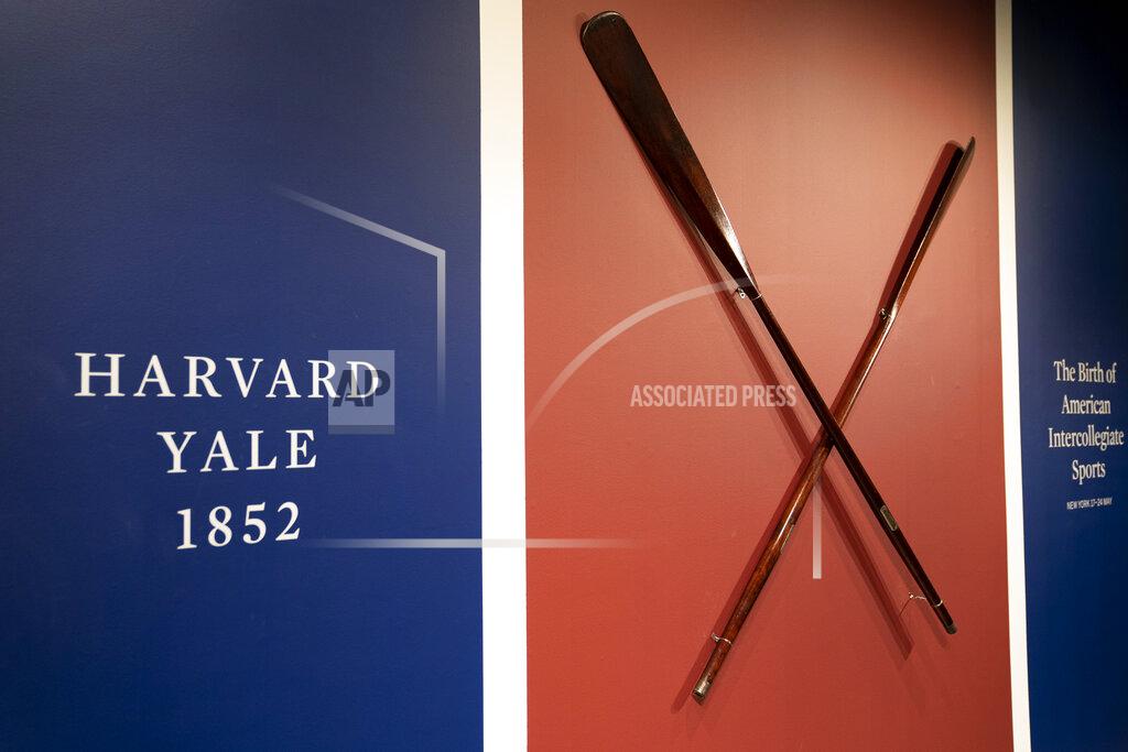 The Harvard-Yale Regatta 1852 Trophy Oars are displayed before an auction, Thursday, April 21, 2022, at Sotheby's in the Manhattan borough of New York. Sotheby's estimates the oars value between three and five million dollars. The oars were awarded to Harvard's winning crew and represent one of the oldest collegiate athletic competitions in the nation's history. (AP Photo/John Minchillo)