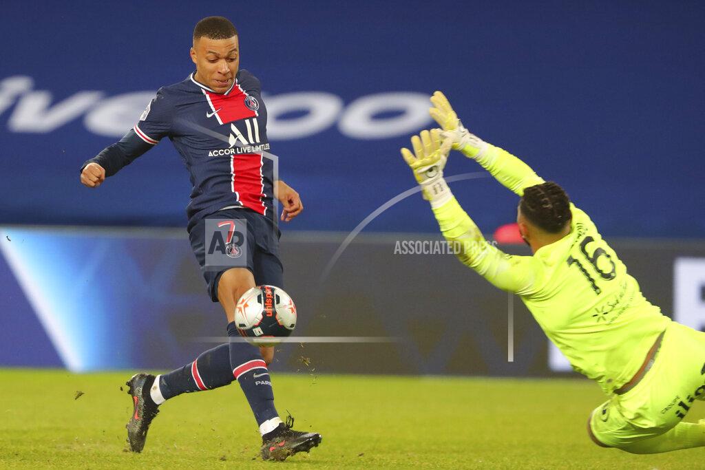 Thibault Camus PSG's Kylian Mbappe scores his side's opening goal during the French League One soccer match between Paris Saint-Germain and Montpellier at the Parc des Princes stadium in Paris, France, Friday, Jan.22, 2021. (AP Photo/Thibault Camus)