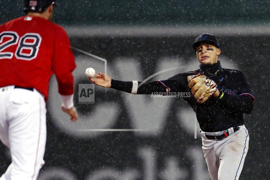 Michael Dwyer Boston Red Sox's J.D. Martinez (28) is forced out at second base as Miami Marlins' Isan Diaz throws to first base on the single by Xander Bogaerts during the fifth inning of a baseball game, Friday, May 28, 2021, in Boston. (AP Photo/Michael Dwyer)