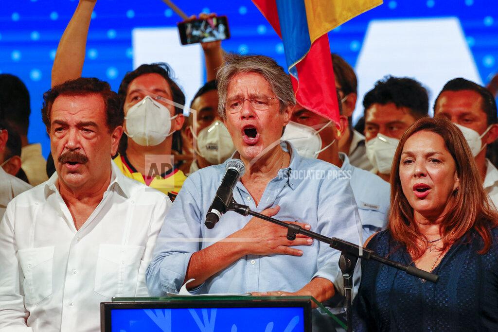 Angel Dejesus Guillermo Lasso, presidential candidate of Creating Opportunities party, CREO, center, celebrates with his wife María de Lourdes Alcívar, right, after a presidential runoff election at his campaign headquarters in Guayaquil, Ecuador, Sunday, April 11, 2021. With most of the votes counted Lasso, a former banker, had a lead over economist Andres Arauz, a protege of former President Rafael Correa.(AP Photo/Angel Dejesus)