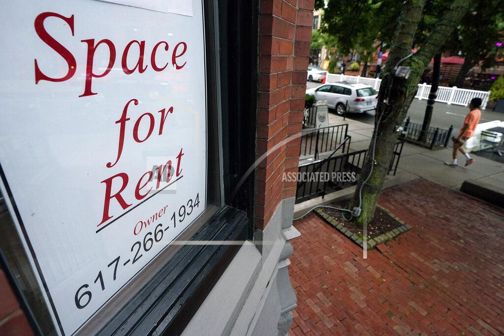 Steven Senne In this Sept. 2, 2020 photo, a passer-by walks past a business storefront with a space for rent sign in a window in Boston. Commercial real estate has been among the industries hardest hit by the pandemic, and there are doubts about how quickly it will recover. Vacancy rates for retail, office and other property types are up sharply from a year ago. (AP Photo/Steven Senne)