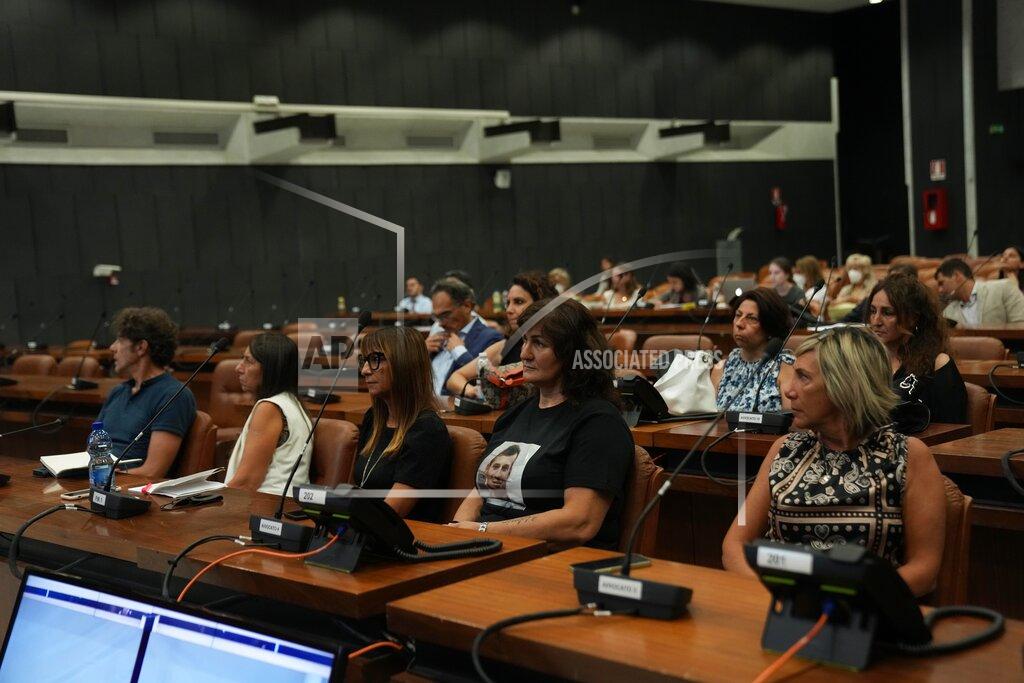 Antonio Calanni Relatives of the Morandi bridge collapse victims follow the start of the trial at the Genoa's Palace of Justice, Thursday, July 7, 2022. Forty-three people were killed when a large stretch of the Morandi Bridge broke off, August 14, 2018, on the eve of one of Italy's biggest vacation holidays. (AP Photo/Antonio Calanni)