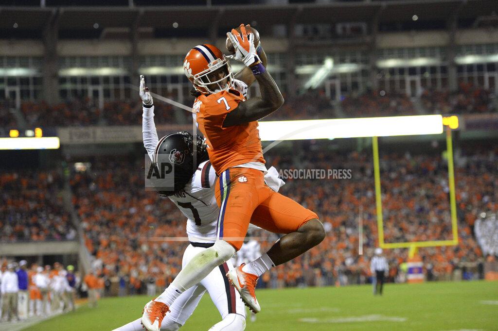 Clemson's Mike Williams pulls in a touchdown reception while defended by South Carolina's Jamarcus King during the first half of an NCAA college football game, Saturday, Nov. 26, 2016, in Clemson, S.C. (AP Photo/Richard Shiro)