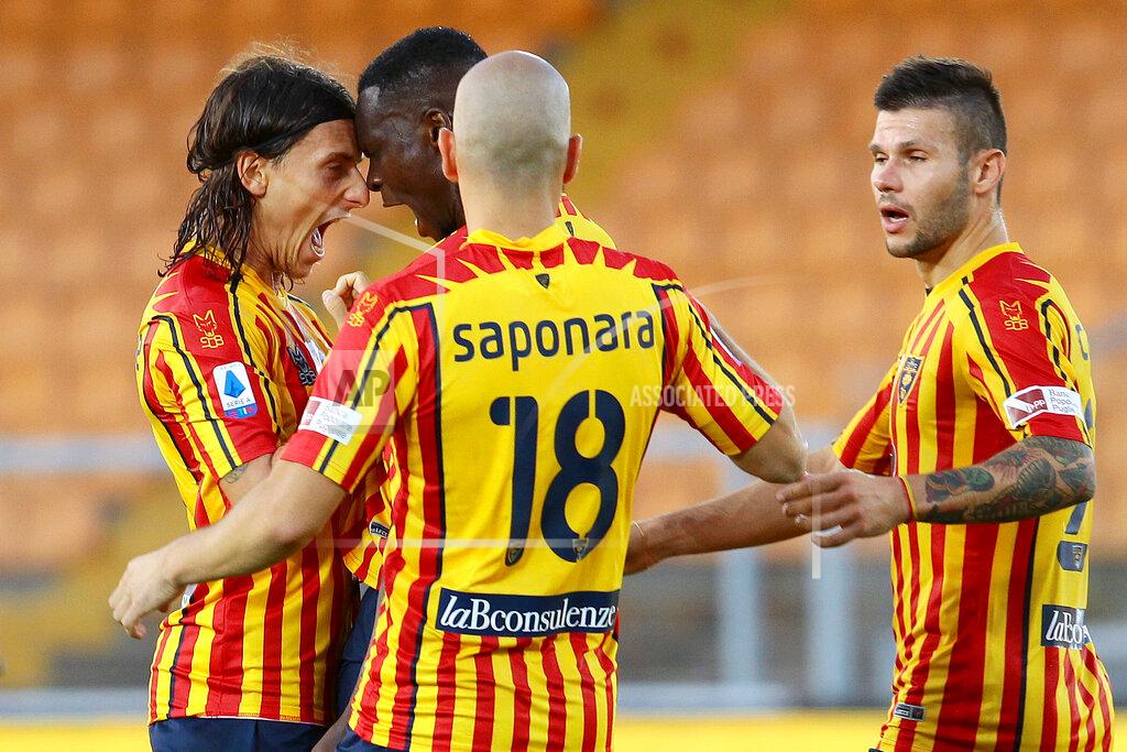 Donato Fasano Lecce's Khouma Babacar, 2nd from left, celebrates with teammates after scoring his side's opening goal during the Serie A soccer match between Lecce and Lazio at the Stadio del Mare in Lecce, Italy, Tuesday, July 7, 2020. (Donato Fasano/LaPresse via AP)