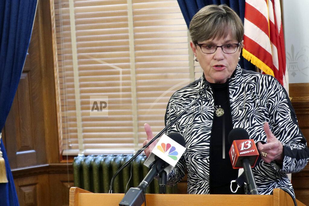 John Hanna Kansas Gov. Laura Kelly discusses an executive order requiring mask wearing and daily temperature checks in all public and private K-12 schools during a news conference, Monday, July 20, 2020, at the Statehouse in Topeka, Kan. Kelly also wants to delay the reopening of schools from mid-August to after Labor Day but needs the State Board of Education's approval. (AP Photo/John Hanna)