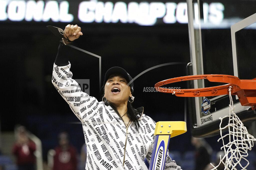 Gerry Broome South Carolina head coach Dawn Staley reacts while cutting the net following a college basketball game against Creighton in the Elite 8 round of the NCAA tournament in Greensboro, N.C., Sunday, March 27, 2022. (AP Photo/Gerry Broome)