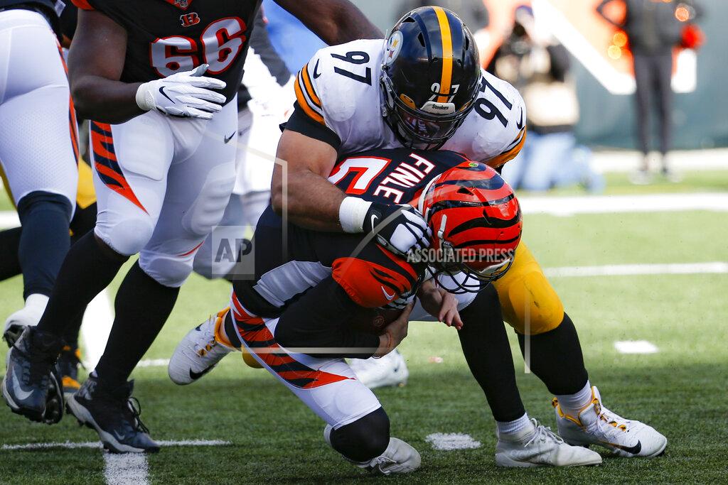 Frank Victores Cincinnati Bengals quarterback Ryan Finley (5) is sacked by Pittsburgh Steelers defensive end Cameron Heyward (97) during the first half an NFL football game, Sunday, Nov. 24, 2019, in Cincinnati. (AP Photo/Frank Victores)