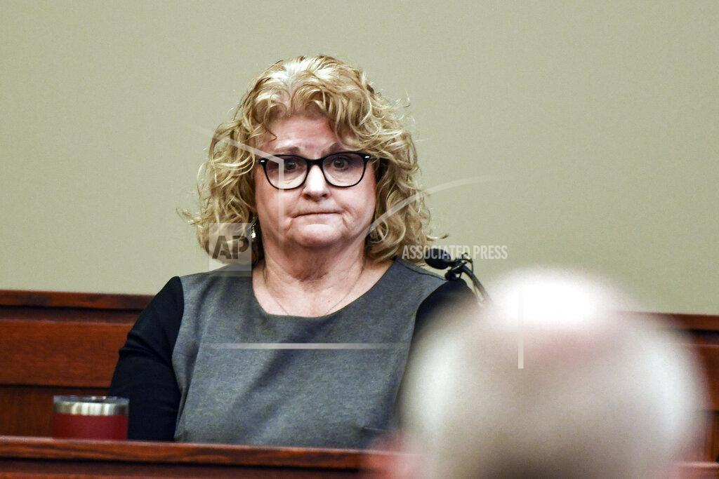 Former Michigan State gymnastics coach Kathie Klages testifies, Friday, Feb. 14, 2020, in Lansing, Mich., during her trial where she faces two counts of lying to police. A jury on Friday found Klages guilty of lying to police when she denied that two teen athletes told her of sexual abuse by sports doctor Larry Nassar in 1997, nearly 20 years before he was charged. She faces up to four years in prison. (Matthew Dae Smith/Lansing State Journal via AP)