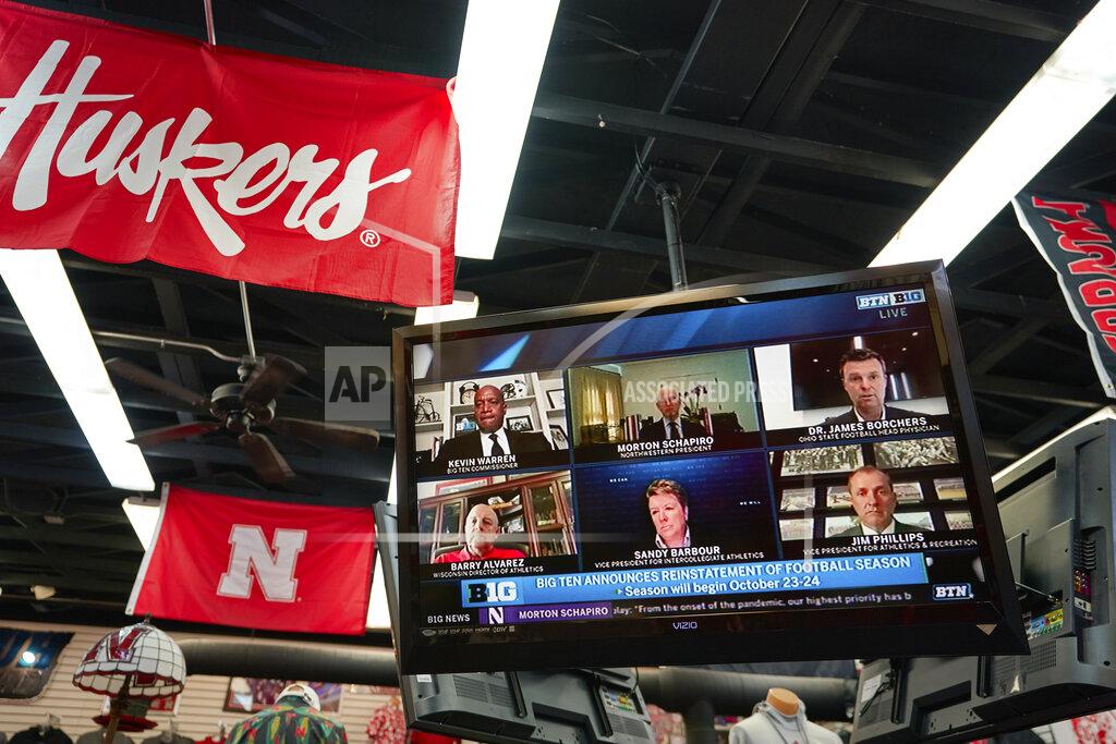 Nati Harnik The Husker Hounds sports apparel store in Omaha, Neb., shows on television screens Wednesday, Sept. 16, 2020, a Big Ten virtual news conference to discuss the reopening of the football season. Less than five weeks after pushing football and other fall sports to spring in the name of player safety during the pandemic, the conference changed course Wednesday and said it plans to begin its season the Oct. 23-24 weekend. Each team will have an eight-game schedule. (AP Photo/Nati Harnik)