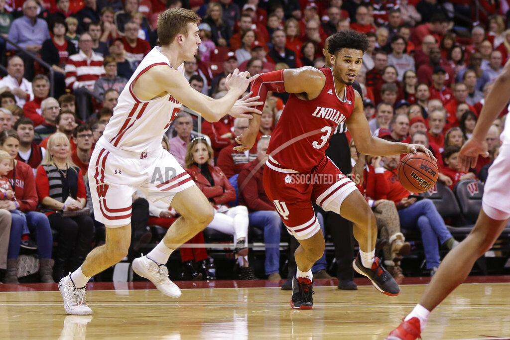 Andy Manis Indiana's Justin Smith (3) drives against Wisconsin's Tyler Wahl (5) during the first half of an NCAA college basketball game Saturday, Dec. 7, 2019, in Madison, Wis. (AP Photo/Andy Manis)