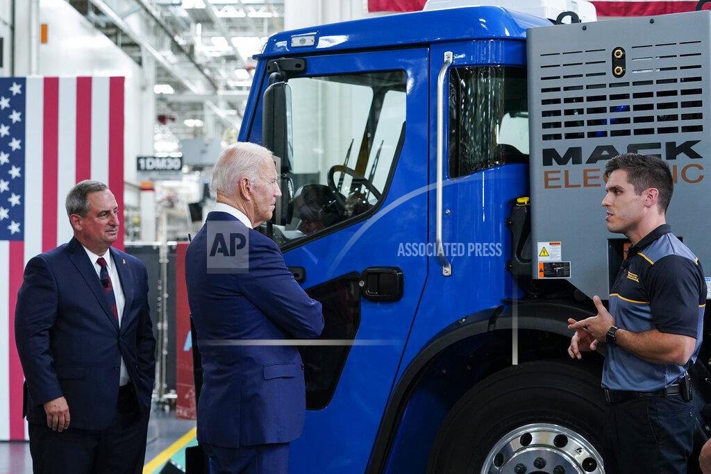 Susan Walsh Mack Trucks President Martin Weissburg, left, President Joe Biden listen as Jake Evans, end-to-end Specialist for Conventional Assembly Operations, right, speaks as Biden tours the Lehigh Valley operations facility for Mack Trucks in Macungie, Pa., Wednesday, July 28, 2021. (AP Photo/Susan Walsh)