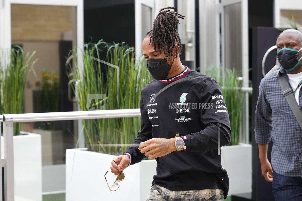 Nick Didlick Mercedes driver Lewis Hamilton, of Britain, walks to a news conference before the Formula One U.S. Grand Prix auto race at Circuit of the Americas, Thursday, Oct. 21, 2021, in Austin, Texas. (AP Photo/Nick Didlick)