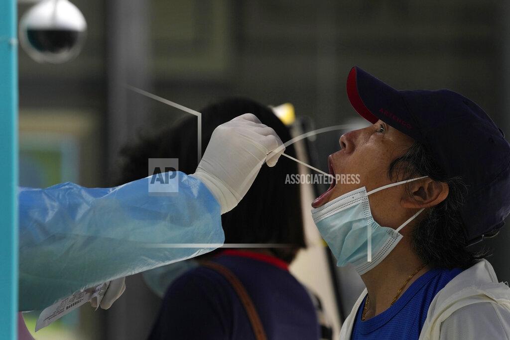 Ng Han Guan A resident gets swabbed during mass COVID test on Monday, May 23, 2022, in Beijing. (AP Photo/Ng Han Guan)