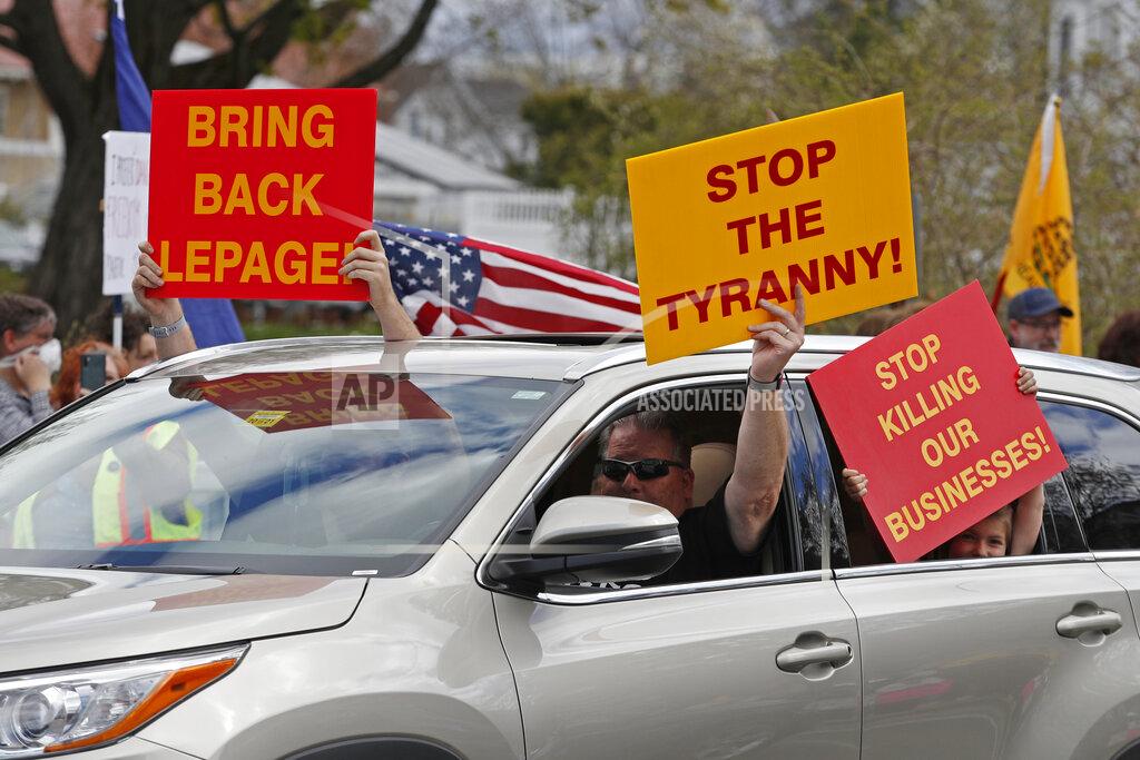 Robert F. Bukaty Protesters rally against the executive orders by Maine Gov. Janet Mills keep some of Maine businesses closed to help prevent the spread of coronavirus, Saturday, May 16, 2020, in Augusta, Maine. (AP Photo/Robert F. Bukaty)
