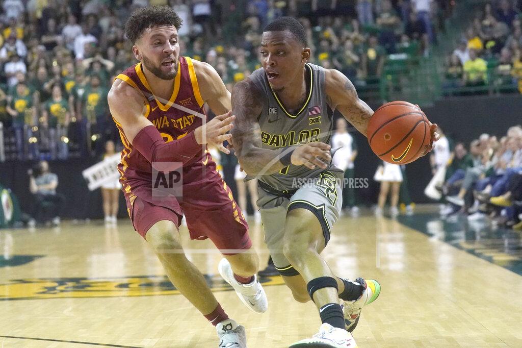 Lm Otero Baylor guard James Akinjo (11) drives against Iowa State guard Gabe Kalscheur (22) during the second half of an NCAA college basketball game in Waco, Texas, Saturday, March 5, 2022. (AP Photo/LM Otero)
