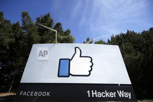 FILE - In this April 14, 2020 file photo, the thumbs up Like logo is shown on a sign at Facebook headquarters in Menlo Park, Calif. Facebook says it plans to hire 10,000 workers in the European Union over the next five years to work on a new computing platform. The company said in a blog post Sunday, Oct. 17, 2021 that those high-skilled workers will help build “the metaverse,” a futuristic notion for connecting people online that uses augmented and virtual reality. (AP Photo/Jeff Chiu, File)