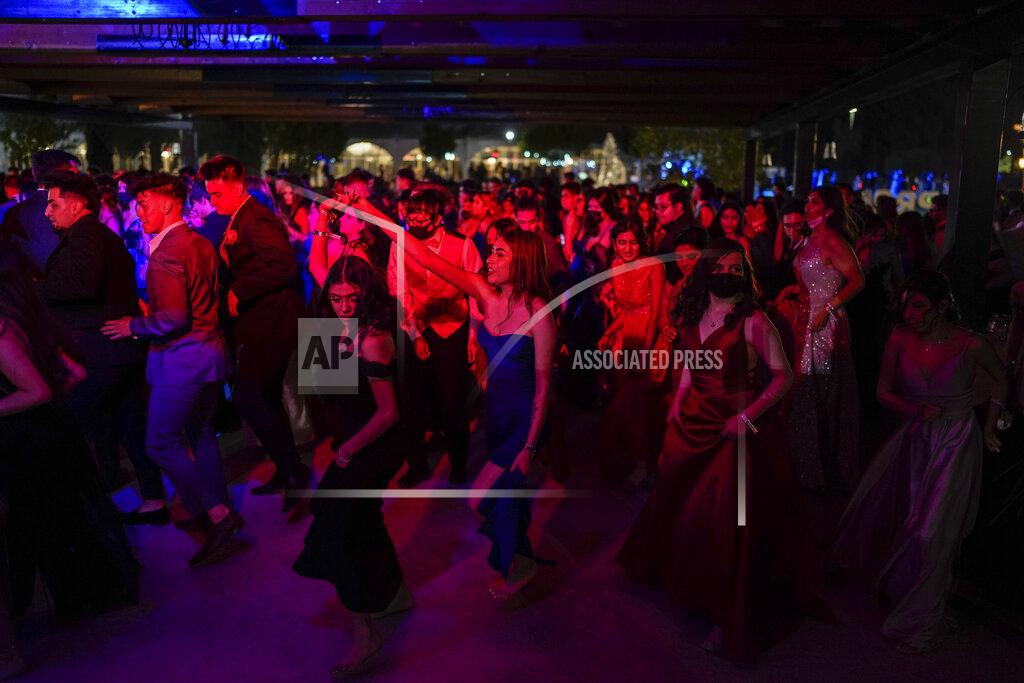 Paul Ratje Young people attend prom at the Grace Gardens Event Center in El Paso, Texas on Friday, May 7, 2021. Around 2,000 attended the outdoor event at the private venue after local school districts announced they would not host proms this year. Tickets cost $45. (AP Photo/Paul Ratje)