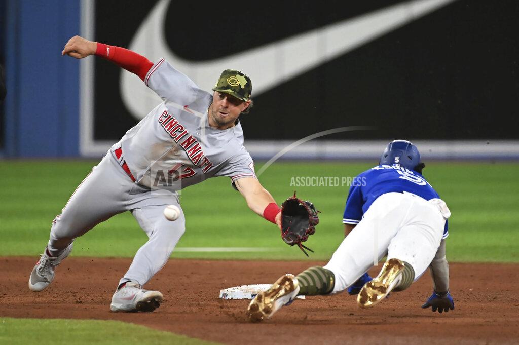 Jon Blacker Toronto Blue Jays' Santiago Espinal, right, is caught attempting to steal second base by Cincinnati Reds' Kyle Farmer during the eighth inning of a baseball game Friday, May 20, 2022, in Toronto. (Jon Blacker/The Canadian Press via AP)
