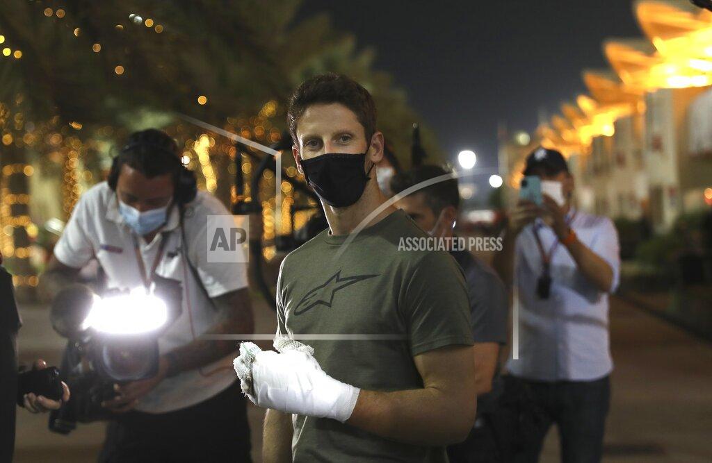 Kamran Jebreili FILE - Haas driver Romain Grosjean of France arrives to the paddock to thank the marshals in Bahrain International Circuit in Sakhir, Bahrain, in this Thursday, Dec. 3, 2020, file photo. Grosjean escaped with only minor burns when his Haas car exploded into a fireball after crashing on the first lap at the Bahrain GP. Mercedes announced Wednesday, May 5, 2021, that Grosjean will drive Lewis Hamilton’s 2019 championship-winning car at the French Grand Prix on June 27 before a full test day at Circuit Paul Ricard two days later. (AP Photo/Kamran Jebreili, File)