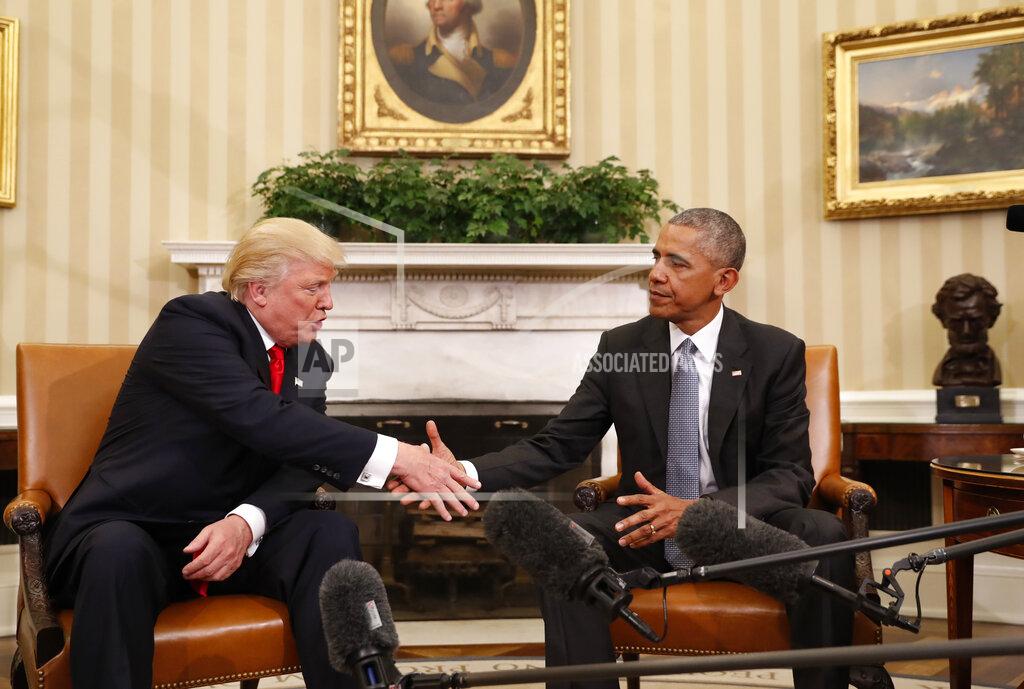 Pablo Martinez Monsivais President Barack Obama shakes hands with President-elect Donald Trump in the Oval Office of the White House in Washington, Thursday, Nov. 10, 2016. President Trump and his allies are harking back to his own transition four years ago to make a false argument that his own presidency was denied a fair chance for a clean launch. Press secretary Kayleigh McEnany laid out the case from the White House podium last week. Obama, who had portrayed Trump as an existential threat to the nation, invited the president-elect to the White House and visited with him in the Oval Office. Obama's aides also offered help to Trump's incoming staffers. (AP Photo/Pablo Martinez Monsivais)