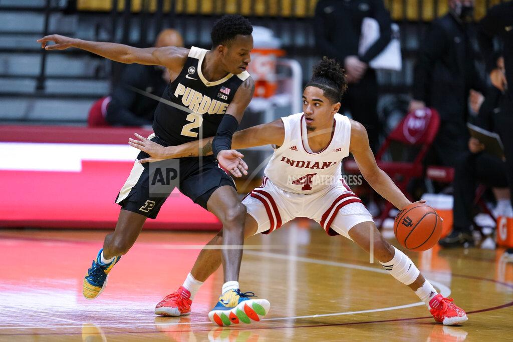 Darron Cummings Indiana's Khristian Lander (4) is defended by Purdue's Eric Hunter Jr. (2) during the first half of an NCAA college basketball game Thursday, Jan. 14, 2021, in Bloomington Ind. (AP Photo/Darron Cummings)