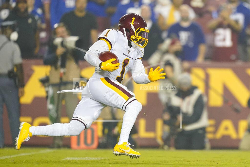 Patrick Semansky Washington Football Team wide receiver DeAndre Carter (1) running with the ball during the first half of an NFL football game, Thursday, Sept. 16, 2021, in Landover, Md. (AP Photo/Patrick Semansky)