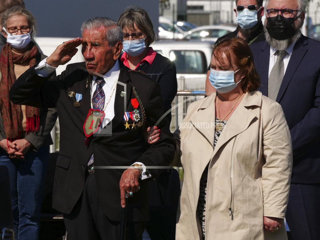 Nicolas Garriga Charles Shay, the 96-year-old native American from Indian Island, Maine, salutes during a D-Day ceremony in Carentan, Normandy, Friday, June 4, 2021. In a small Normandy town where paratroopers landed in the early hours of D-Day, applauds broke the silence to honor Charles Shay. He was the only veteran to attend the ceremony in Carentan commemorating the 77th anniversary of the assault that led to the end World War II. Shay was a 19-year-old U.S. Army medic when he landed on Omaha Beach. (AP Photo/Nicolas Garriga)