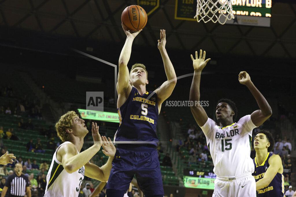 Rod Aydelotte Northern Colorado guard Dalton Knecht (5) attempts a shot over Baylor forward Caleb Lohner (33) and forward Josh Ojianwuna (15) in the first half of an NCAA college basketball game, Monday, Nov. 14, 2022, in Waco, Texas. (AP Photo/Rod Aydelotte)