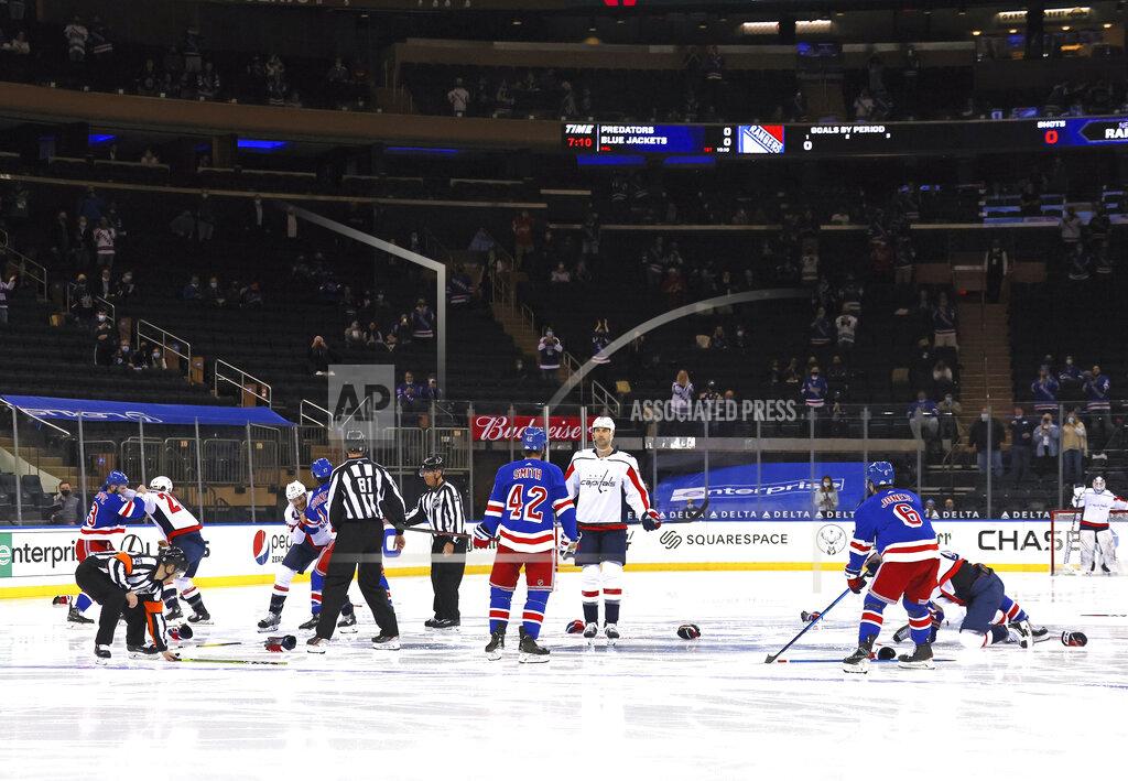 Bruce Bennett Washington Capitals and New York Rangers fight in the opening seconds of an NHL hockey game Wednesday, May 5, 2021, in New York. (Bruce Bennett/Pool Photo via AP)