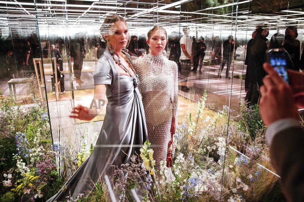 Francois Mori FILE - In this Jan. 27, 2021 file photo, model Kate Moss, left, and her daughter Lila Grace Moss wear a creation for Fendi's Spring-Summer 2021 Haute Couture fashion collection presented in Paris. The pandemic has torn a multibillion-dollar bite out of the fabric of Europe's luxury industry, stopped runway shows and forced brands to show their designs digitally instead. Now, amid hopes of a return to near-normality by the year’s end, the industry is asking what fashion will look like as it dusts itself and struggles to its well-heeled feet again. (AP Photo/Francois Mori, File)