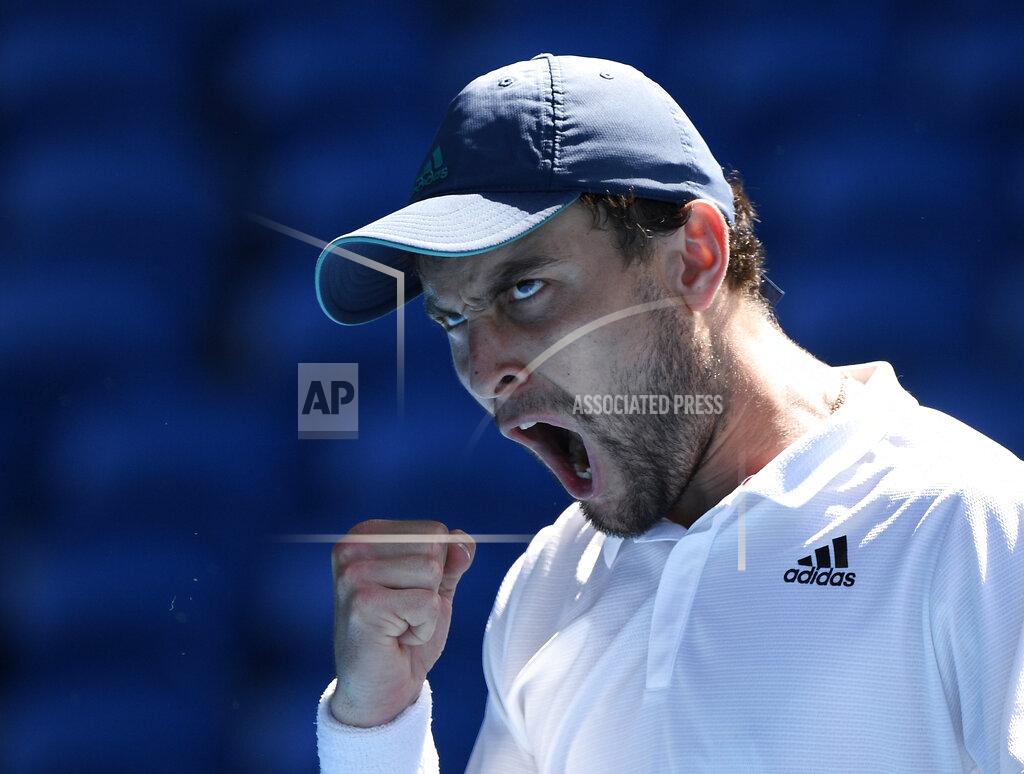 Andy Brownbill Russia's Aslan Karatsev winning the fourth set against Canada's Felix Auger-Aliassime during their fourth round match at the Australian Open tennis championships in Melbourne, Australia, Sunday, Feb. 14, 2021. The Australian Open continues but without crowds after the Victoria state government imposed a five-day lockdown in response to a COVID-19 outbreak at a quarantine hotel. (AP Photo/Andy Brownbill)