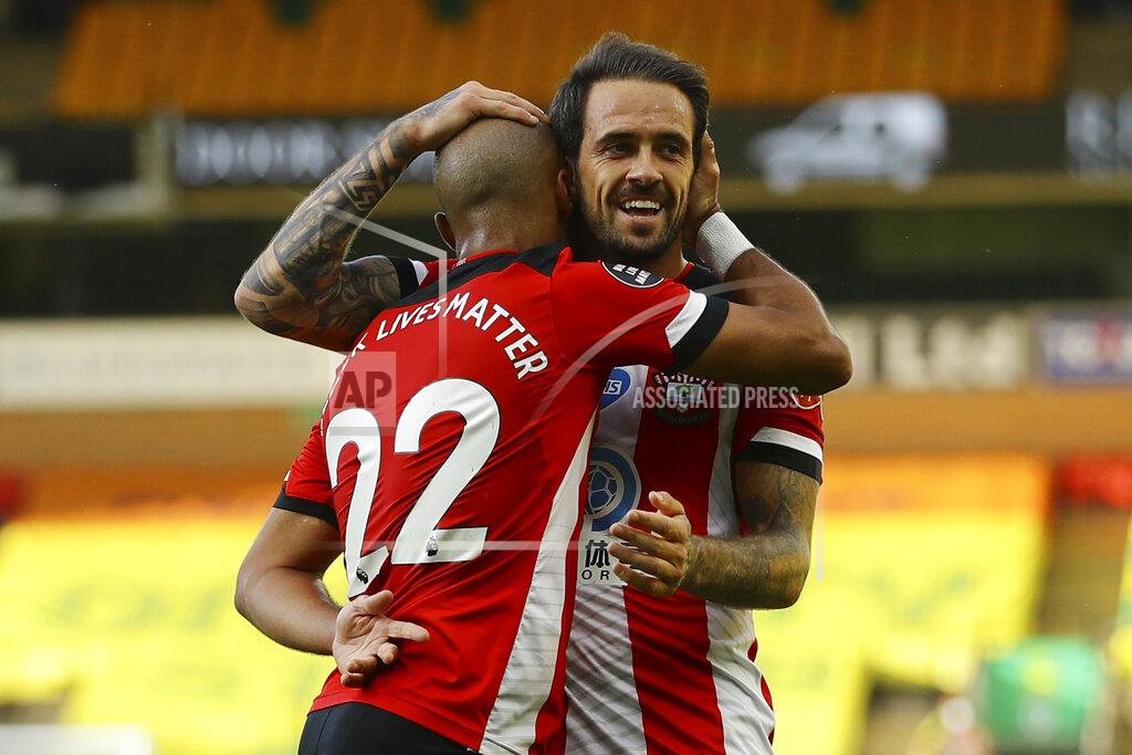 Richard Heathcote Southampton's Nathan Redmond, left, celebrates with his teammate Danny Ings scoring his side's third goal during the English Premier League soccer match between Norwich City and Southampton at Carrow Road in Norwich, England, Friday, June 19, 2020. (AP Photo/Richard Heathcote/Pool)