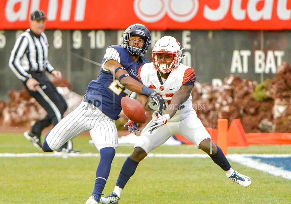 Howard Simmons Notre Dame safety Nick Coleman (24) breaks up a pass to Syracuse wide receiver Nykeim Johnson (82) during the first half of an NCAA college football game, Saturday, Nov. 17, 2018, at Yankee Stadium in New York. (AP Photo/Howard Simmons)