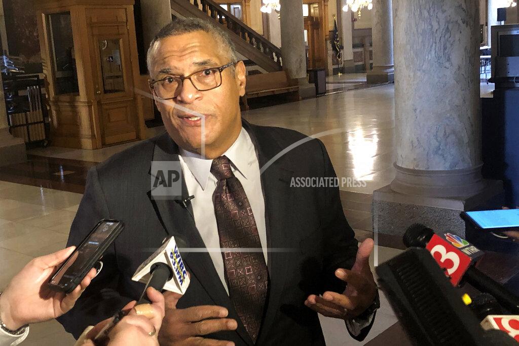 Tom Davies FILE - In this Feb. 7, 2020, file photo, Democratic gubernatorial candidate Dr. Woody Myers speaks to the media as he hands over paperwork to put his name on the Democratic primary ballot for Indiana governor at the Statehouse in Indianapolis. Indiana Gov. Eric Holcomb announced steps Tuesday, Aug. 18, 2020, toward tackling racial injustice concerns that include equipping state police troopers with body cameras and hiring a state government equality officer who’ll report directly to him. Myers, an African American who is challenging Holcomb in the November election, disparaged Holcomb’s proposals as disingenuous for coming after nearly 16 years of Republican control of the governor’s office. (AP Photo/Tom Davies, File)