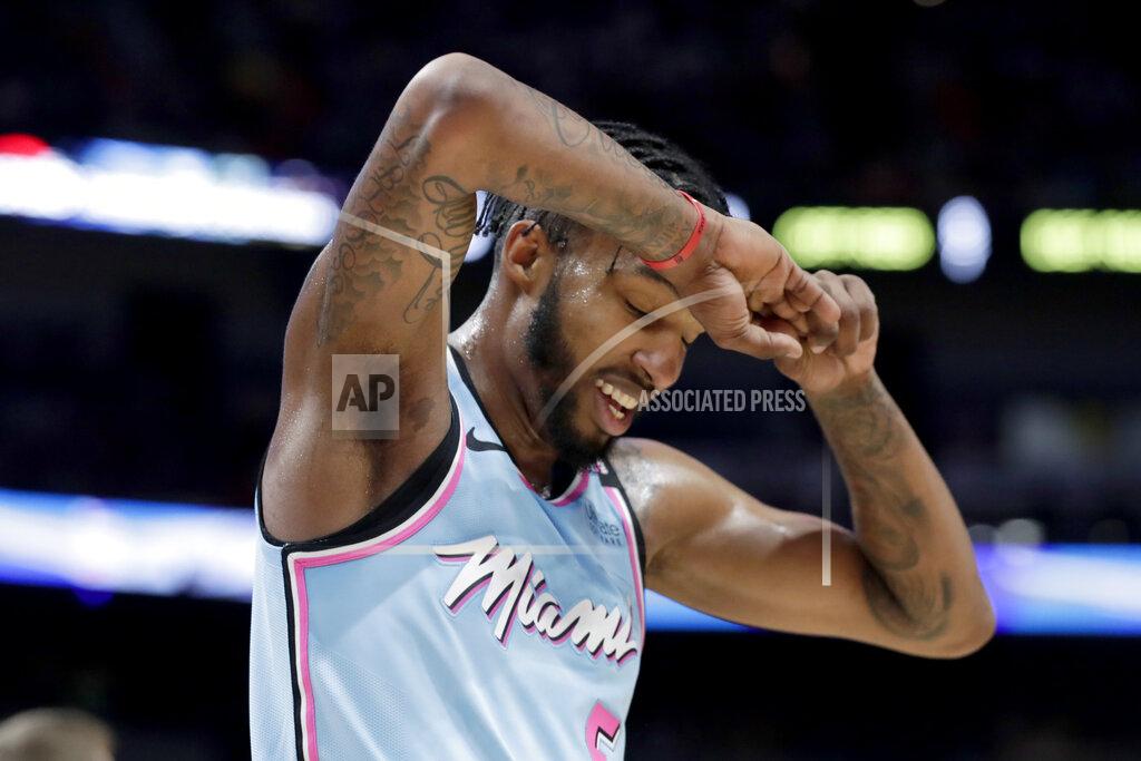 Lynne Sladky FILE - In this Jan. 28, 2020, file photo, Miami Heat forward Derrick Jones Jr. reacts after being called for a foul during the second half of an NBA basketball game against the Boston Celtics, in Miami. A person with knowledge of the situation says Miami forward Derrick Jones Jr. has tested positive for the coronavirus. His result came in shortly after the Heat and other NBA teams began mandatory testing in preparation for next month’s resumption of the season. Jones still plans to play when the Heat get back on the floor at the Disney complex near Orlando next month. (AP Photo/Lynne Sladky, File)