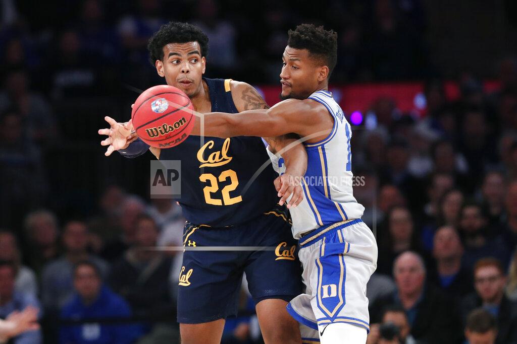 Kathy Willens A pass-attempt by California forward Andre Kelly (22) is interrupted by Duke forward Javin DeLaurier, right, during the first half of the first round of the 2K Empire Classic NCAA college basketball tournament, Thursday, Nov. 21, 2019, in New York. (AP Photo/Kathy Willens)