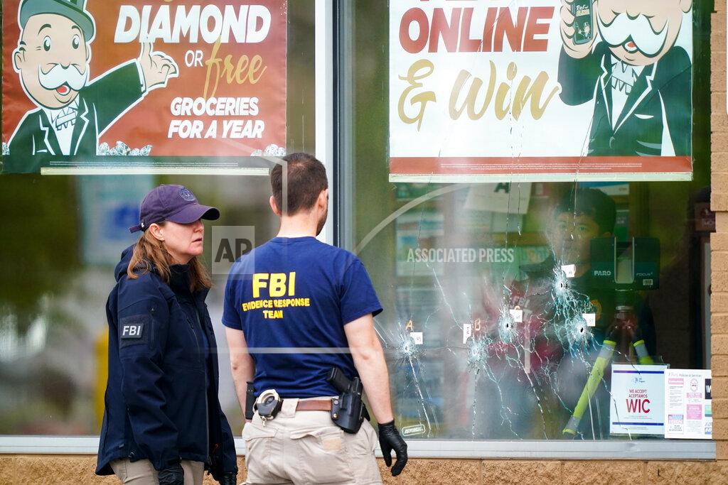 Matt Rourke Investigators work the scene of a shooting at a supermarket, in Buffalo, N.Y., Monday, May 16, 2022. (AP Photo/Matt Rourke)