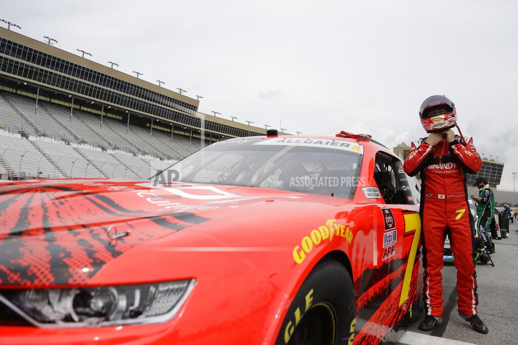 Brynn Anderson Justin Allgaier (7) puts on his helmet before a NASCAR Xfinity Series auto race at Atlanta Motor Speedway, Saturday, June 6, 2020, in Hampton, Ga. (AP Photo/Brynn Anderson)
