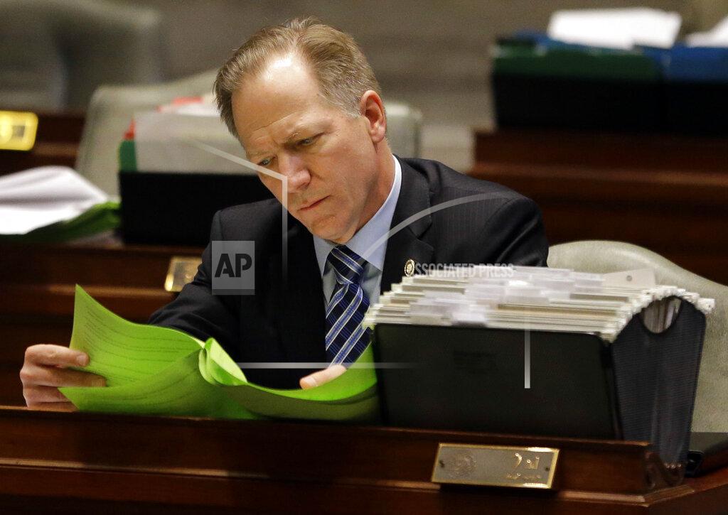 Jeff Roberson FILE- In this Thursday, March 31, 2016 file photo, Missouri state Sen. Bob Onder, R-Lake Saint Louis, works at his desk in the Senate chamber in Jefferson City, Mo. State lawmakers across the country will be convening in 2021 with the continuing COVID-19 pandemic rippling through much of their work — and even affecting the way they work. After 10 months of emergency orders and restrictions from governors and local executive officials, some state lawmakers are eager to reassert their power over statewide decisions shaping the way people shop, work, worship and attend school (AP Photo/Jeff Roberson, File)