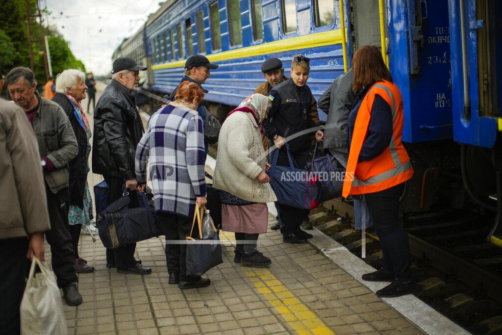 Francisco Seco People fleeing from heavy shelling board an evacuation train at Pokrovsk train station, in Pokrovsk, eastern Ukraine, Sunday, May 22, 2022. Civilians fleeing areas near the eastern front in the war in Ukraine Sunday described scenes of devastation as their towns and villages came under sustained attack from Russian forces. (AP Photo/Francisco Seco)