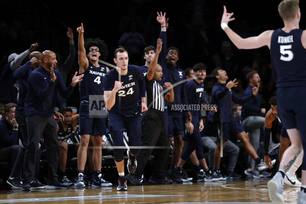 Adam Hunger Xavier's Jack Nunge (24) clenches his fist after making a 3-point basket against Virginia Tech during the second half of an NCAA college basketball game in the NIT Season Tip-Off tournament Friday, Nov. 26, 2021, in New York. Xavier won 59-58. (AP Photo/Adam Hunger)