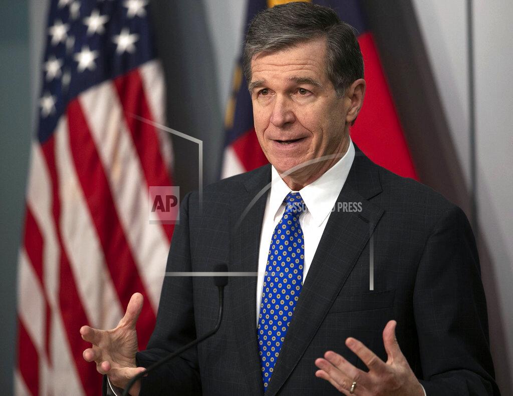 North Carolina Governor Roy Cooper speaks a press briefing on the COVID-19 virus, vaccination efforts, winter storms and schools reopening on Thursday, February 18, 2021 at the Emergency Operations Center in Raleigh, N.C.(Robert Willett/The News & Observer via AP)