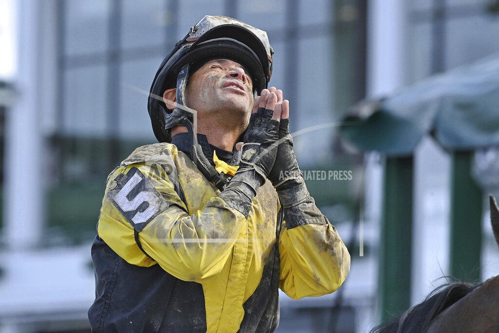 Joe Labozetta This photo provided by Equi-Photo shows jockey Jose Ferrer gesturing after winning the Salvatore Mile aboard Informative at Monmouth Park Racetrack in Oceanport, N.J., Saturday June 12, 2021. Ferrer, 57, is leading all jockeys in wins at Monmouth Park in New Jersey after 10 days of racing with 16 wins in 56 mounts. (Joe Labozxetta/Equi-Photo via AP)