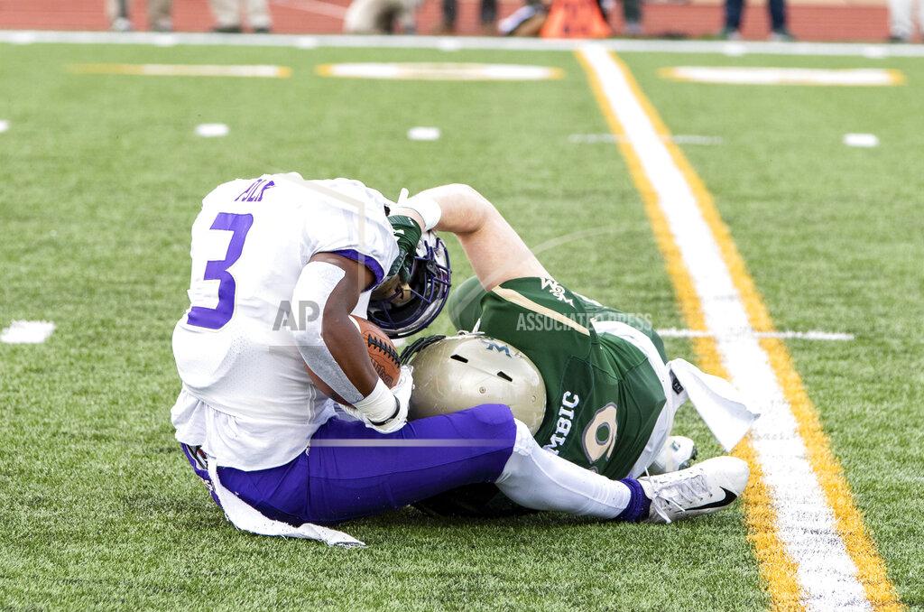 Mike Caudill William & Mary's Trey Zgombic, right, brings down James Madison's Brandon Polk (3) on a kickoff return during the first half of an NCAA college football game in Williamsburg, Va., on Saturday, Oct. 19, 2019. (Mike Caudill/The Virginian-Pilot via AP)