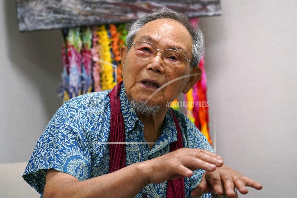 Eugene Hoshiko Lee Jong-keun speaks his experience of atomic bombing during an interview with The Associated Press in Hiroshima, western Japan Tuesday, Aug. 4, 2020. For nearly 70 years, until he turned 85, Lee hid his past as an atomic bomb survivor, fearful of the widespread discrimination against blast victims that has long persisted in Japan. But Lee, 92, is now part of a fast-dwindling group of survivors, known as hibakusha, that feels a growing urgency - desperation even - to tell their stories. (AP Photo/Eugene Hoshiko)