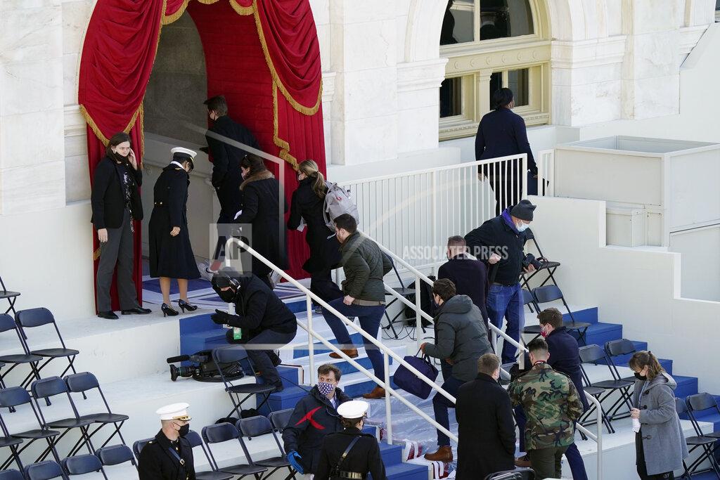 Carolyn Kaster People evacuate from the West Front of the U.S. Capitol during a rehearsal the 59th Presidential Inauguration at the U.S. Capitol in Washington, Monday, Jan. 18, 2021. (AP Photo/Carolyn Kaster)